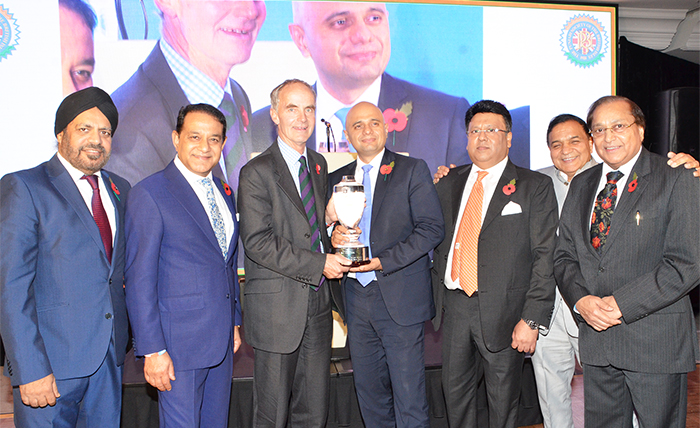 Rt Hon Sajid Javid receiving the Pride of Punjab Award from the Chairman of Combat Stress- Lieutenant General Andrew Graham